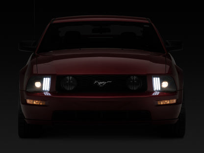 Raxiom 05-09 Ford Mustang w/ Halogen Prjctor Headlights- Black Housing (Clear Lens) (No GT500 )