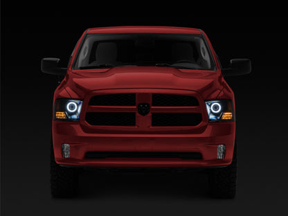 Raxiom 09-18 RAM 1500 Super White LED Halo Projector Headlights- Black Housing (Clear Lens)